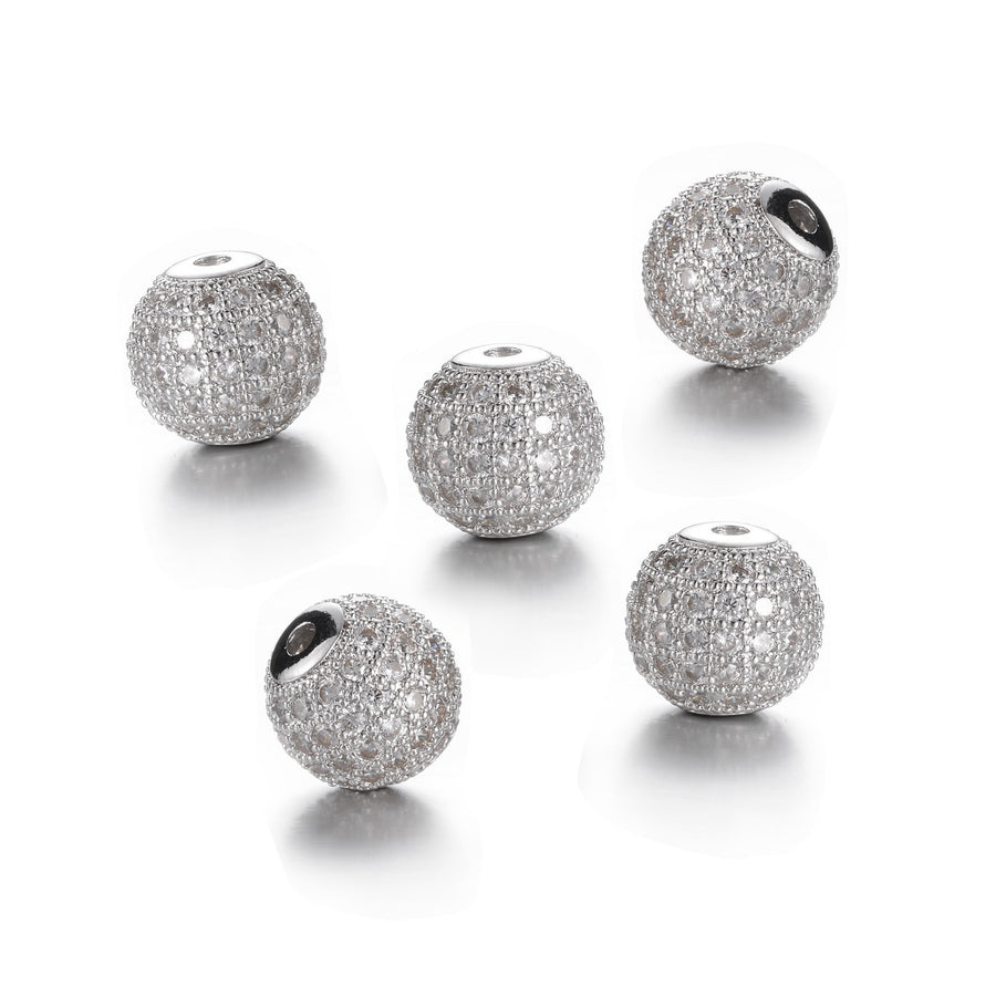 Round Brass Micro Pave Cubic Zirconia Spacer Beads, Platinum Silver Color Charm Spacers for DIY Jewelry Making. Focal Beads for Bracelet and Necklace Making.  Size: 10mm Diameter, Hole: 2mm, Quantity: 1pcs/package.  Material: Clear Crystal Cubic Zirconia Brass Micro Pave Round Spacer Bead. Platinum Color. Shinny, Sparkling Finish.