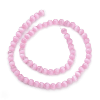 Cat Eye Glass Beads, Round, Pink Color.  Size: 6mm Diameter, Hole: 1mm; approx. 64pcs/strand, 14" Inches Long  Material: Glass Beads; Cats Eye Glass Beads. Pink Color. Polished, Shinny Finish.