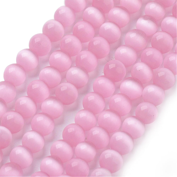 Cat Eye Glass Beads, Round, Pink Color.  Size: 6mm Diameter, Hole: 1mm; approx. 64pcs/strand, 14" Inches Long  Material: Glass Beads; Cats Eye Glass Beads. Pink Color. Polished, Shinny Finish.