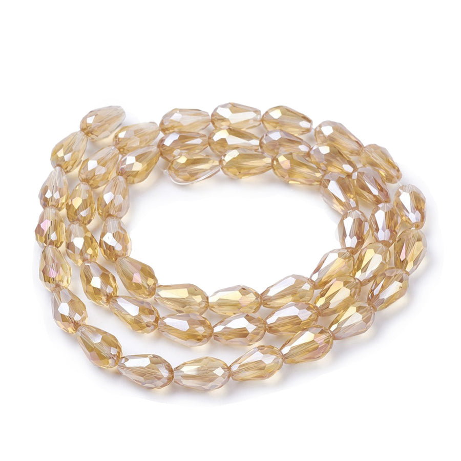 Teardrop Crystal Glass Beads, Faceted, Champagne Color, Glass Crystal Bead Strands. Shinny, Premium Quality Crystal Beads for Jewelry Making.  Size: 15mm Length, 10mm Thick, Hole: 1.5mm; approx. 48pcs/strand, 30" inches long.  Material: The Beads are Made from Glass. Glass Crystal Beads, Teardrop Shaped, Champaign Beige Khaki Colored Beads. Polished, Shinny Finish.
