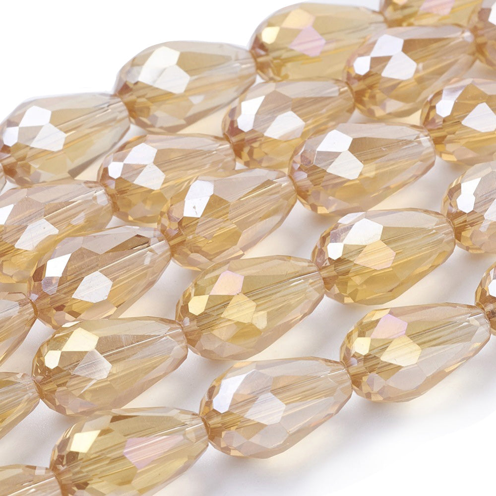 Teardrop Crystal Glass Beads, Faceted, Champagne Color, Glass Crystal Bead Strands. Shinny, Premium Quality Crystal Beads for Jewelry Making.  Size: 15mm Length, 10mm Thick, Hole: 1.5mm; approx. 48pcs/strand, 30" inches long.  Material: The Beads are Made from Glass. Glass Crystal Beads, Teardrop Shaped, Champaign Beige Khaki Colored Beads. Polished, Shinny Finish.