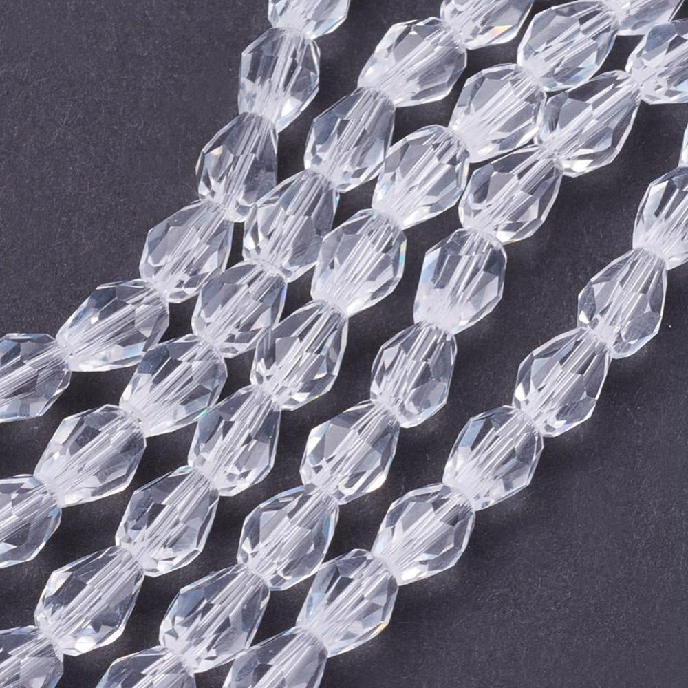 Teardrop Crystal Glass Beads, Faceted, Transparent Clear Color, Glass Crystal Bead Strands. Shinny Crystal Beads for Jewelry Making.  Size: 6mm Length, 4mm Thick, Hole: 1mm; approx. 72pcs/strand, 15" inches long.  Material: The Beads are Made from Glass. Glass Crystal Beads, Teardrop Shaped, Clear Glass Beads. Austrian Crystal Imitation. Polished, Shinny Finish.
