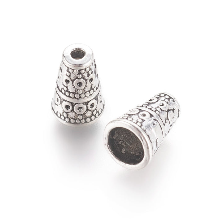 Alloy Bead Cones, Antique Silver Colored Cones for DIY Jewelry Making. Add the perfect Finishing Touch to Your Jewelry Designs with these Stylish Cones. Jewelry Finishing Ends.  Size: 7mm Diameter, 10mm Length, Hole: 2mm, Quantity: 5pcs/bag.
