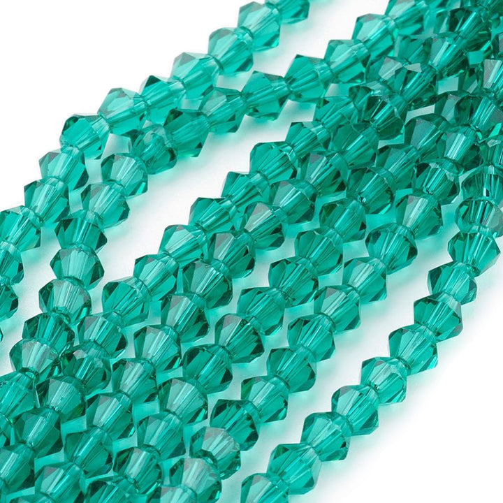 Glass Beads, Faceted, Dark Cyan Color, Bicone, Crystal Beads for Jewelry Making.  Size: 4mm Length, 4mm Width, Hole: 1mm; approx. 92pcs/strand, 13.75" inches long.  Material: The Beads are Made from Glass. Austrian Crystal Imitation Glass Crystal Beads, Bicone, Dark Cyan Colored Beads. Polished, Shinny Finish.