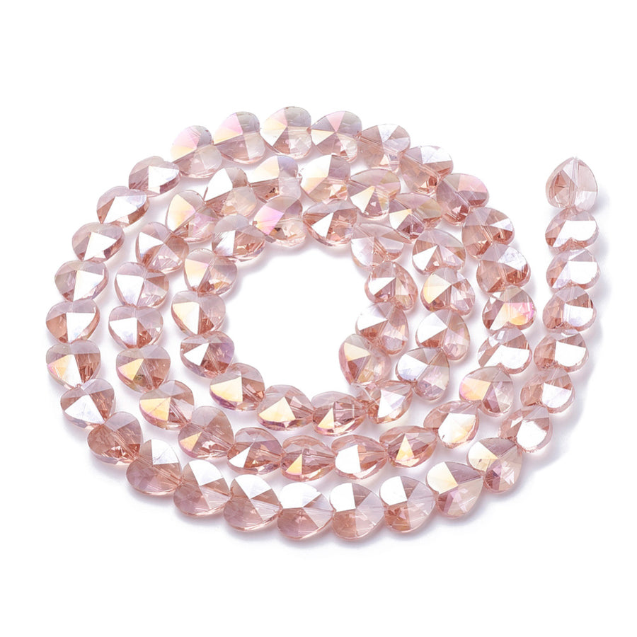 Electroplated Glass Beads, Heart Shaped Glass Beads, Salmon Pink Color. Perfect for Valentines day Jewelry Designs.  Size: 10mm Wide, 10mm Long and 6.5mm Thick, Hole: 0.8mm Qty: 10 pcs/package  Material: Electroplated Glass, Faceted, Salmon Pink Color Beads, Smooth Shinny Finish.