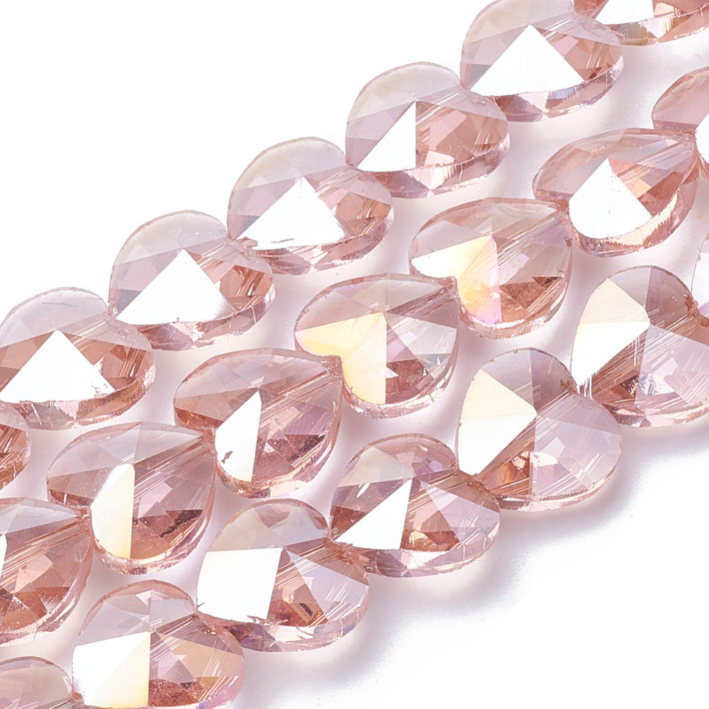 Electroplated Glass Beads, Heart Shaped Glass Beads, Salmon Pink Color. Perfect for Valentines day Jewelry Designs.  Size: 10mm Wide, 10mm Long and 6.5mm Thick, Hole: 0.8mm Qty: 10 pcs/package  Material: Electroplated Glass, Faceted, Salmon Pink Color Beads, Smooth Shinny Finish.