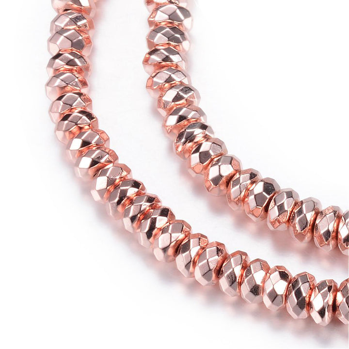 Faceted Electroplated Non-Magnetic Synthetic Hematite Beads, Rose Gold Plated. Semi-Precious Stone Spacer Beads for Jewelry Making.   Size: 4-4.5mm Wide, 2mm Thick, Hole: 1mm, approx. 175pcs/strand, 15.5" Inches Long.  Material: Faceted Non-Magnetic Synthetic Hematite Beads. Rose Gold Color Plated. Rondelle Shape. Polished, Shinny Metallic Lustrous Finish.