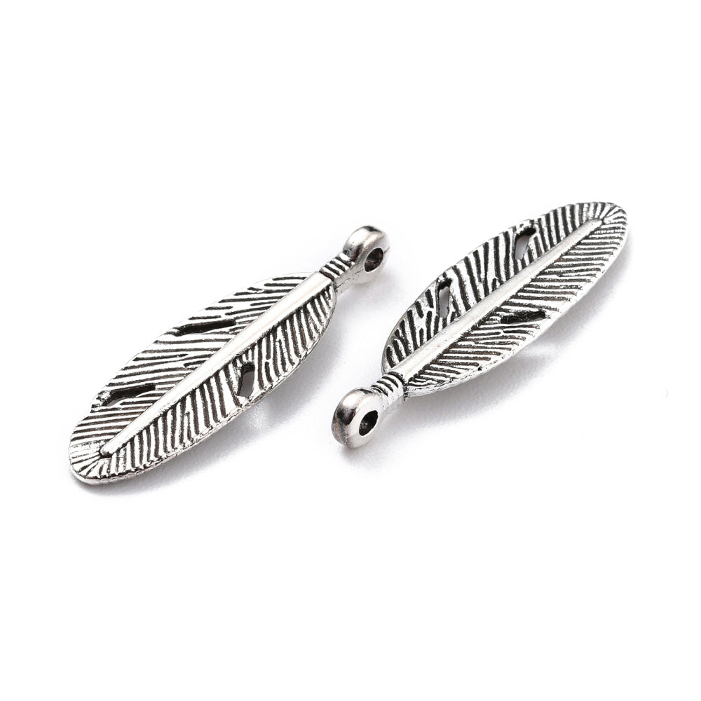 Silver Sunflower Charm Beads, Antique Silver Colored Vintage Feather Charms for DIY Jewelry Making. Feather Charms for Bracelet and Necklace Making.  Size: 29mm Length, 9.5mm Width, 2.5mm Thick, Hole: 1.8mm, Quantity: 10 pcs/package.  Material: Alloy (Lead and Nickel Free) Feather Charms. Antique Silver Color. Shinny Finish.