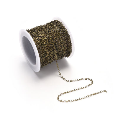 Brass Cable Chain, Antique Bronze Color Brass Soldered Cable Chains for making DIY Jewelry.  Color: Antique Bronze  Size: 2.2x1.9x0.3mm sold per/10m Roll (32.8 Feet)  Material: Brass Soldered Cable Chain Roll with Spool, Flat, Oval, Bronze Color Chain.