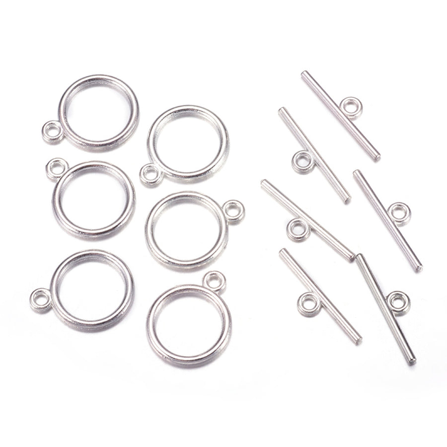 Toggle Ring Clasp for DIY Jewelry Making. Antique Silver Color, Flat, Round Clasps.  Size: Ring: 15mm, 2mm Thick, Bar: 21mm, Hole: 2mm, 5 set/package.  Material: Alloy Toggle Clasps, Cadmium, Nickel and Lead Free, Antique Silver Color Clasp.   Usage: These Clasp are used to finish of necklaces or bracelets.