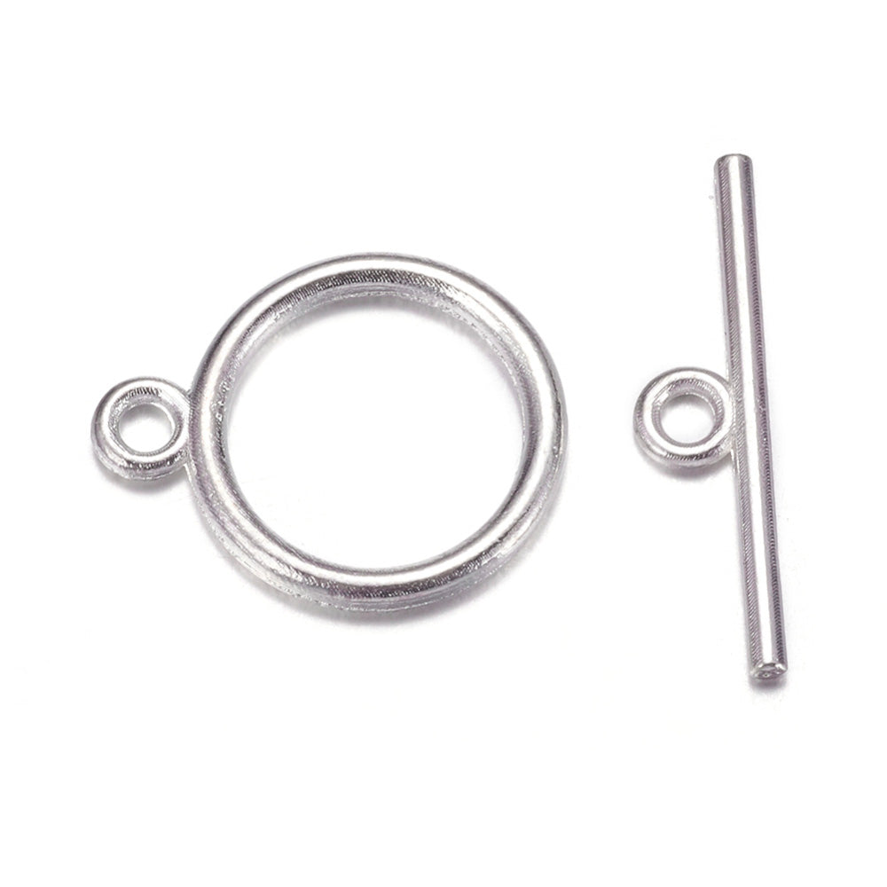 Toggle Ring Clasp for DIY Jewelry Making. Antique Silver Color, Flat, Round Clasps.  Size: Ring: 15mm, 2mm Thick, Bar: 21mm, Hole: 2mm, 5 set/package.  Material: Alloy Toggle Clasps, Cadmium, Nickel and Lead Free, Antique Silver Color Clasp.   Usage: These Clasp are used to finish of necklaces or bracelets.