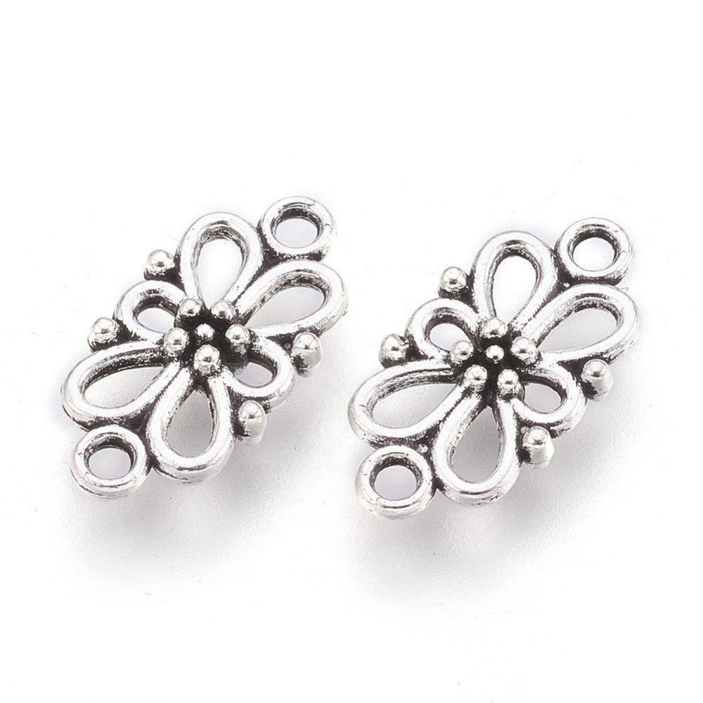 Link Connectors, Flower Shape. Antique Silver Colored Connector for DIY Jewelry Making.   Size: 16mm Length, 8mm Width, 3.5mm Thick, Hole: 1.5mm, Quantity: 5pcs/bag.  Material: Alloy (Lead and Cadmium Free) Connectors, Links. Flower Shaped. Antique Silver Color. Shinny Finish.