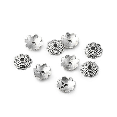 Antique Silver Bead Caps, Alloy Flower Spacer Beads. Flower Shaped Bead Caps, Antique Silver Color. Flower Spacers for DIY Jewelry Making Projects.   Size: 8mm Diameter, 2mm Thick, Hole: 1mm, approx. 50pcs/package  Material: Alloy Flower Bead Caps. Antique Silver Color.