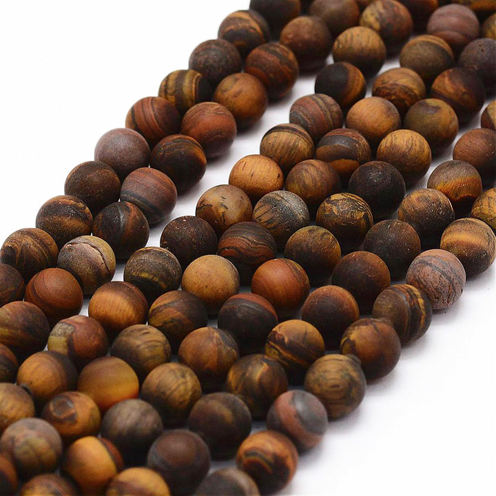 Frosted Natural Tiger Eye Beads, Round. Matte Semi-precious Gemstone Tiger Eye Beads for DIY Jewelry Making.  High Quality Beads for Making Mala Bracelets.  Size: 6mm Diameter, Hole: 0.8mm, approx. 64pcs/strand, 15 inches.  Material: Genuine Natural Yellow Tiger Eye Unpolished Loose Stone Beads, High Quality Frosted Stone Beads. Matte Finish.  www.beadlot.com