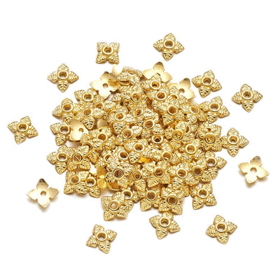 Alloy Flower Spacer Beads. Flower Shaped Bead Caps, Gold Color. Flower Spacers for DIY Jewelry Making Projects.   Size: 6mm Diameter, 2mm Thick, Hole: 1mm, approx. 20pcs/package.  Material: Alloy Flower Bead Caps. Shinny Antique Gold Color. Lead and Nickel Free.