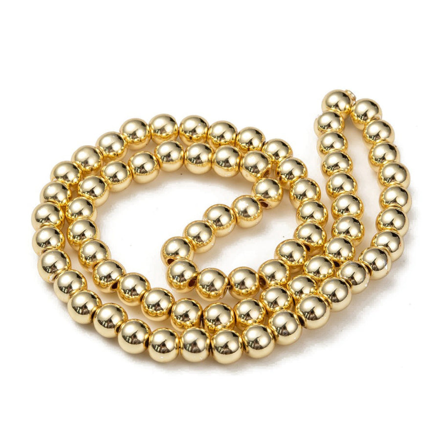 Electroplated Non-Magnetic Hematite Beads, Metallic Gold Color. Semi-Precious Stone Beads for Jewelry Making. Affordable High Quality Spacer Beads for Mala Bracelets.  Size: 6mm Diameter, Hole: 1mm, approx. 67-72pcs/strand, 15.5" Inches Long.  Material: Premium Quality Non-Magnetic Synthetic Hematite Bead Strands. Metallic Gold Color. Polished, Shinny Metallic Lustrous Finish.