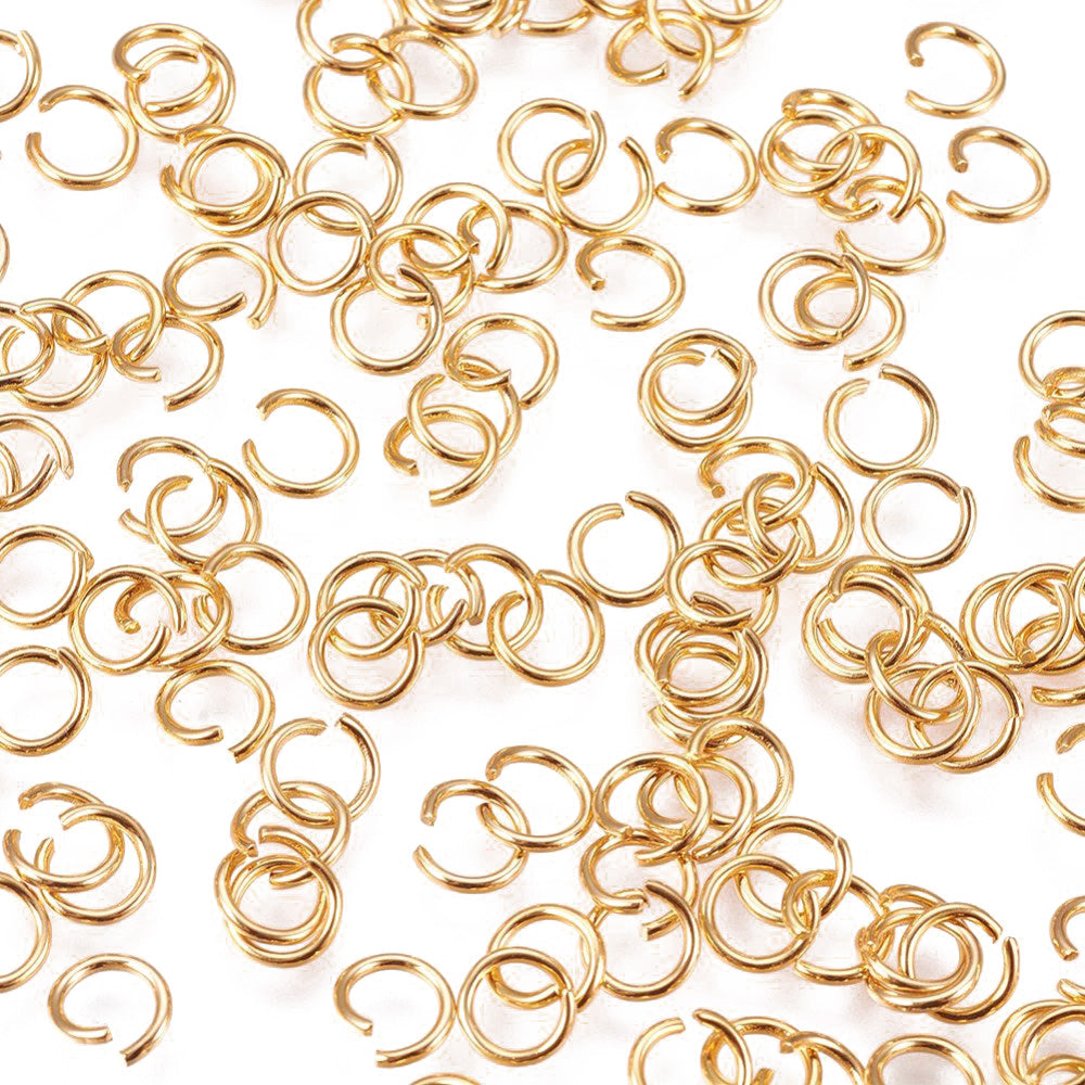 304 Stainless Steel Jump Rings, Open Jump Rings, Gold Color. Great for DIY Jewelry Making, Keychain and Accessory Crafting.  Size: 21 Gauge, 0.7mm Thick, 5mm Diameter, approx. 200pcs/package.  Material :304 Stainless Steel Open Jump Rings, 21 Gauge. Gold Color Metal Connectors.