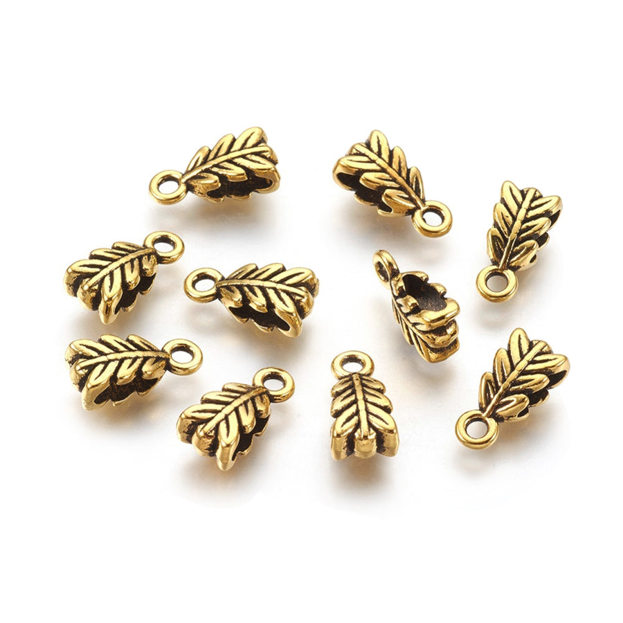 Tibetan Bail Tube Beads, Antique Gold Colored Tube Bails for Jewelry Making.  Size: 4mm Diameter, 6.5mm Width, 14mm Length, Hole: 2mm, Quantity: 5pcs/bag.  Material: Alloy (Lead and Nickel Free) Connectors, Leaf Shaped Bail Beads. Antique Gold Color Hanger Links. Shinny Finish