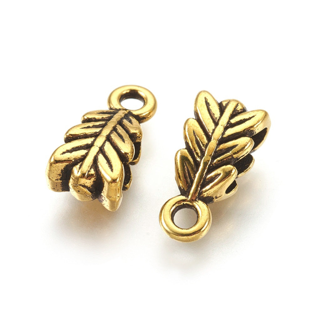 Tibetan Bail Tube Beads, Antique Gold Colored Tube Bails for Jewelry Making.  Size: 4mm Diameter, 6.5mm Width, 14mm Length, Hole: 2mm, Quantity: 5pcs/bag.  Material: Alloy (Lead and Nickel Free) Connectors, Leaf Shaped Bail Beads. Antique Gold Color Hanger Links. Shinny Finish