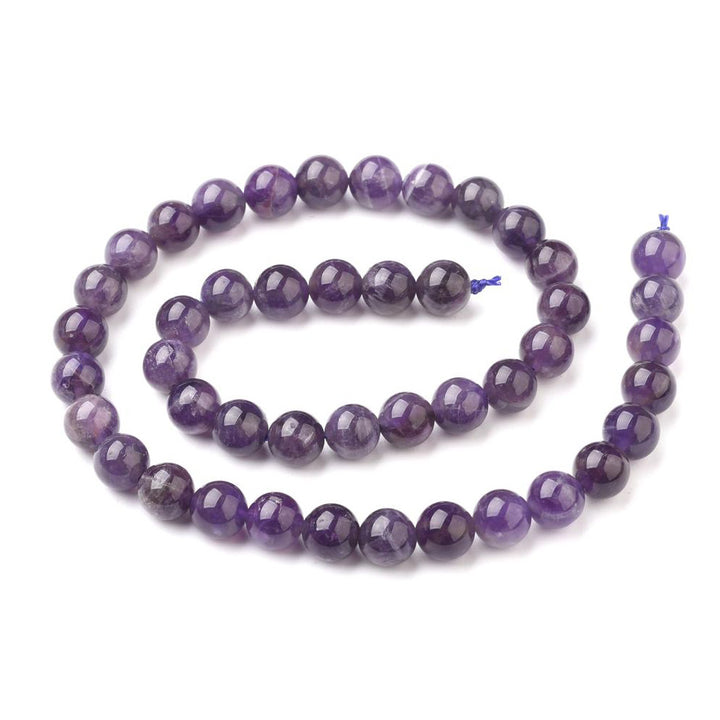 Grade AB Natural Amethyst Beads, Round, Purple Color. Semi-Precious Gemstone Beads for DIY Jewelry Making.   Size: 8mm Diameter, Hole: 1mm; approx. 46-48pcs/strand, 15 Inches Long.  Material: Grade AB Natural Amethyst Beads Purple Color. Polished, Shinny Finish. 