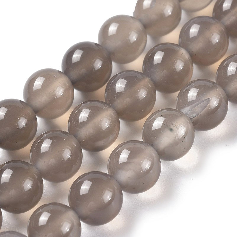 Premium Quality Gray Agate Beads, Round, Grey Color. Semi-Precious Gemstone Beads for Jewelry Making. Great for Stretch Bracelets and Necklaces.  Size: 8mm Diameter, Hole: 1mm; approx. 46pcs/strand, 15" Inches Long.  Material: Grade "A" Premium Quality Gray Agate Loose Stone Beads, Grey Color, Polished, Shinny Finish.