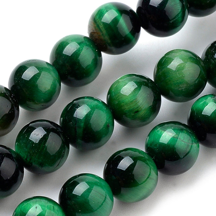 Natural Tiger Eye Beads, Green Colored Semi Precious Stone Beads for DIY Jewelry Making. Gorgeous Green Tiger Eye Gemstone Beads.  Size: 8mm Diameter, Hole: 1mm; approx. 44 pcs/strand 14.9" inches long.  Material: Premium Grade Genuine Natural Green Tiger Eye Polished Loose Stone Beads, High Quality Gemstone Beads. Dyed & Heated, Polished, Shinny Finish. 