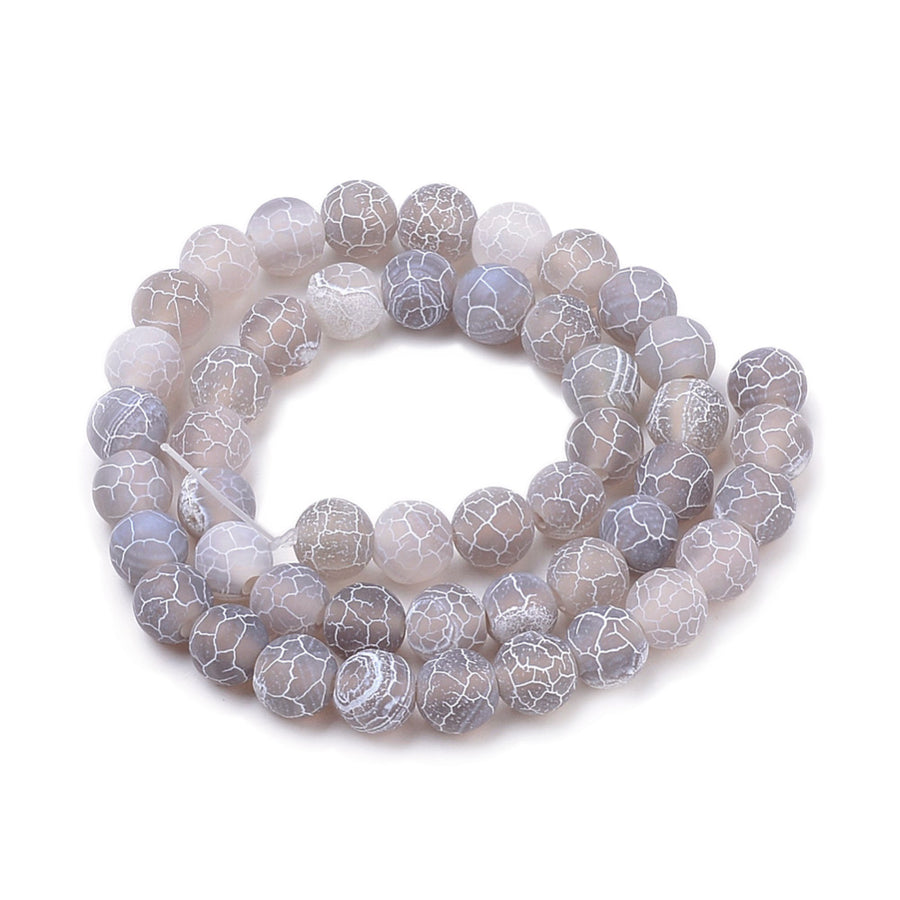 Natural Crackle Agate Beads, Dyed, Round, Grey Color. Matte Semi-Precious Gemstone Beads for Jewelry Making. Great for Stretch Bracelets and Necklaces.  Size: 8mm Diameter, Hole: 1mm; approx. 47pcs/strand, 14.5" Inches Long.  Material: Natural & Dyed Crackle Agate, Frosted Grey Color with White Crackle Pattern. The Crackle Appearance is Created by Heating the Stone to Extreme Temperatures. Unpolished, Matte Finish.