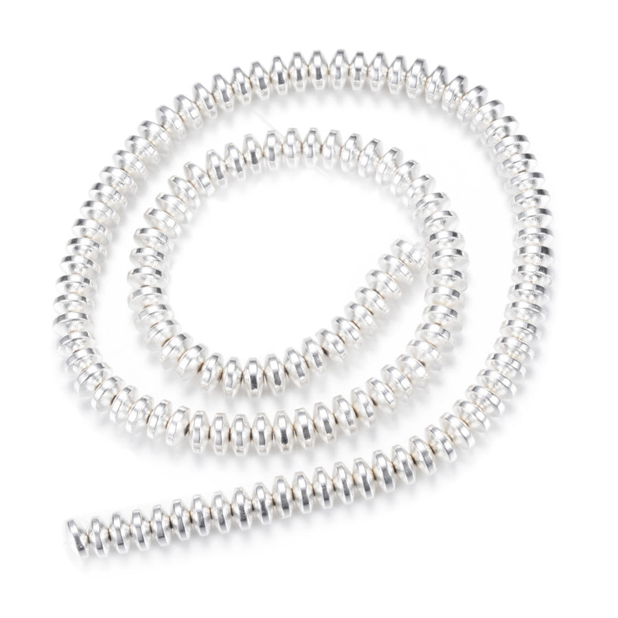 Electroplated Non-Magnetic Synthetic Hematite Beads, Silver Color. Semi-Precious Stone Spacer Beads for Jewelry Making.   Size: 6mm Wide, 3mm Thick, Hole: 1mm, approx. 125pcs/strand, 15.5" Inches Long.  Material: Non-Magnetic Synthetic Hematite Beads. Silver Color Plated. Rondelle Shape. Polished, Shinny Metallic Lustrous Finish.