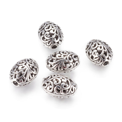 Large Hollow Oval Focal Bead with a Design, Antique Silver Color, Oval Shape for DIY Jewelry Making.   Size: 16.5mm Width, 22mm Length, 12.5mm Thick, Hole: 3mm, Qty: 1pcs/package.  Material: Alloy Large Hole Beads. Antique Silver Color with a Pattern.