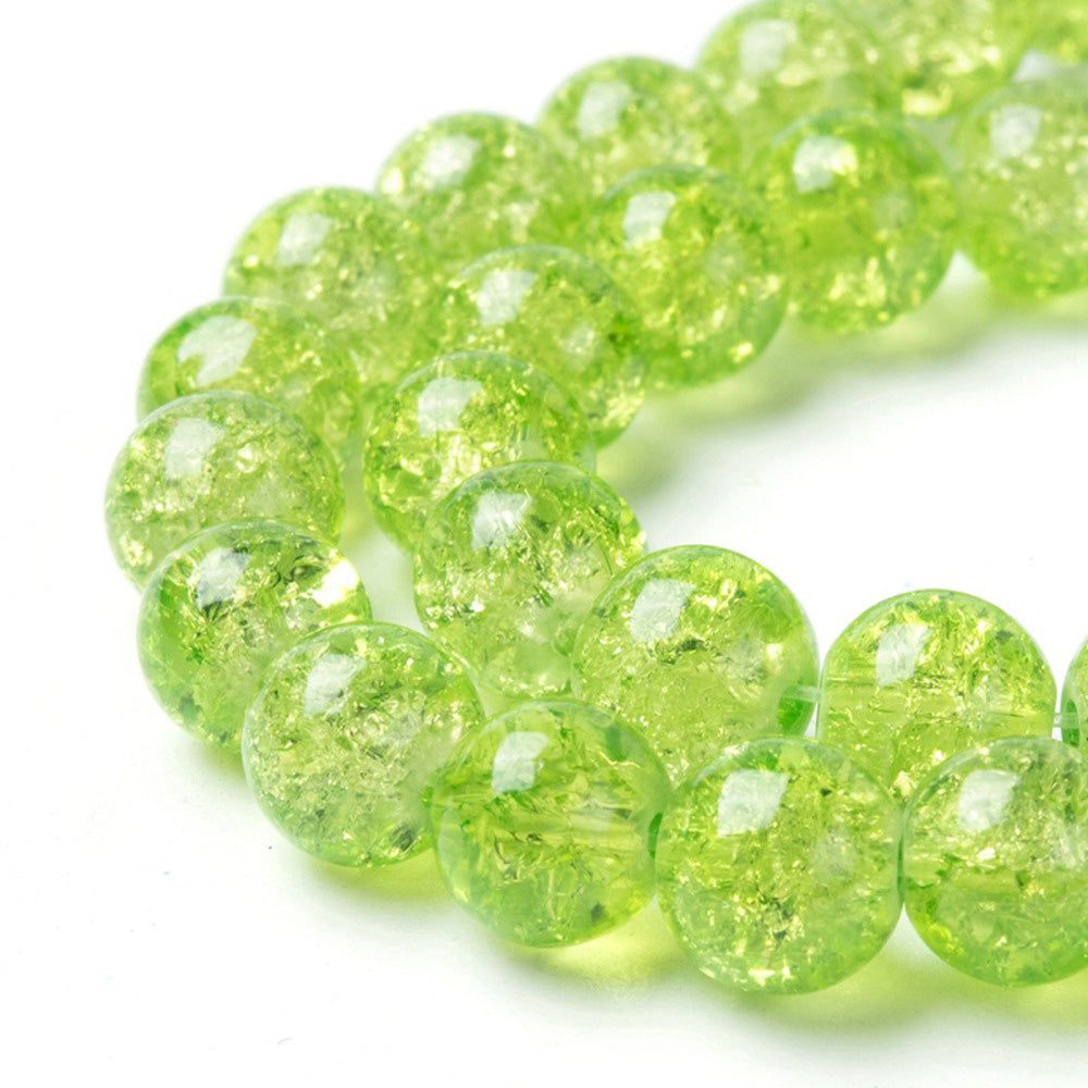 Popular Crackle Glass Beads, Round, Light Lime Green Color. Glass Bead Strands for DIY Jewelry Making. Affordable, Colorful Crackle Beads. Great for Stretch Bracelets.  Size: 4mm Diameter Hole: 1.1mm; approx. 198pcs/strand, 31" Inches Long  Material: The Beads are Made from Glass. Crackle Glass Beads, Lime Green Colored Beads with Clear Markings.  Polished, Shinny Finish.