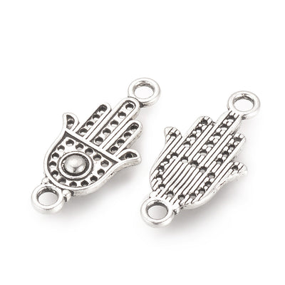 Tibetan Link Connectors, Hamsa Hand Shape. Antique Silver Colored Connector Charm for DIY Jewelry Making.   Size: 20mm Length, 10mm Width, 2mm Thick, Hole: 2mm, Quantity: 5pcs/bag.  Material: Alloy (Lead and Cadmium Free) Connectors, Links. Hamsa Hand Shape. Antique Silver Color. Shinny Finish.