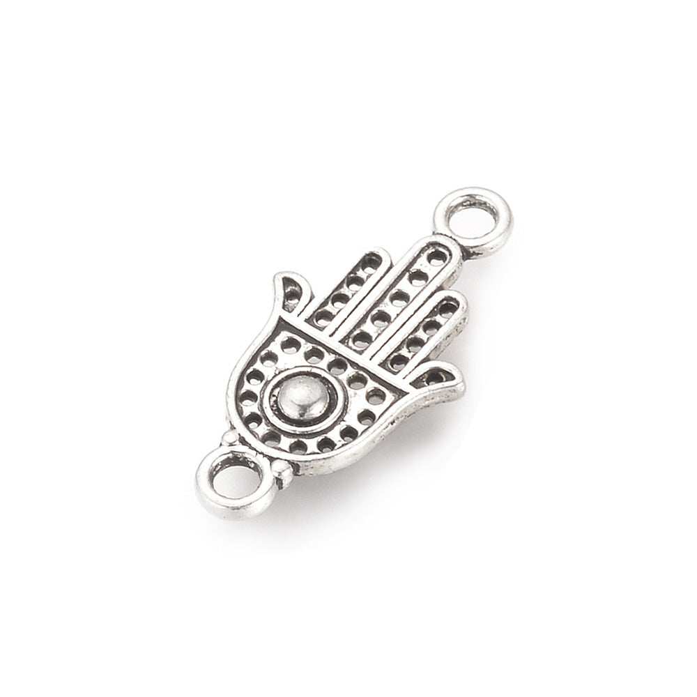 Tibetan Link Connectors, Hamsa Hand Shape. Antique Silver Colored Connector Charm for DIY Jewelry Making.   Size: 20mm Length, 10mm Width, 2mm Thick, Hole: 2mm, Quantity: 5pcs/bag.  Material: Alloy (Lead and Cadmium Free) Connectors, Links. Hamsa Hand Shape. Antique Silver Color. Shinny Finish.