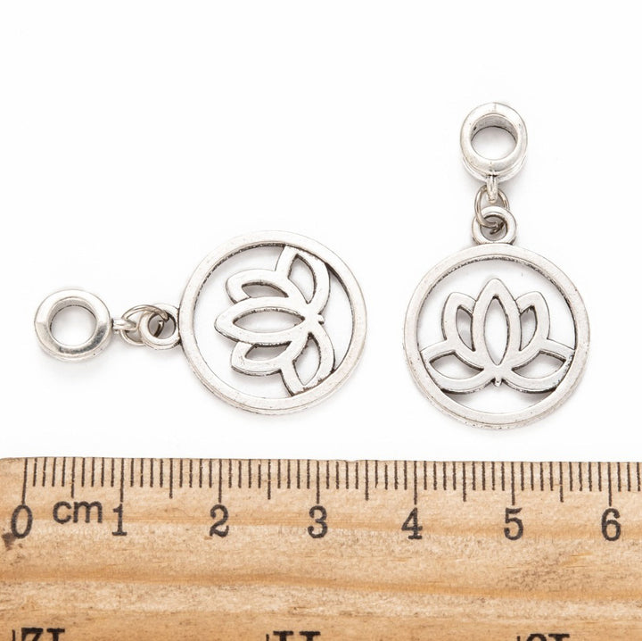 Antique Silver European Large Hole Style Dangle Charms. Yoga Lotus Charm Pendant for DIY Jewelry Making Projects.   Size: 36mm Diameter, Hole: 5mm, approx. 5pcs/bag.   Material: Alloy Dangle Charms Flat Round Charm with Yoga Lotus Design. Antique Silver Color. Shinny Finish.