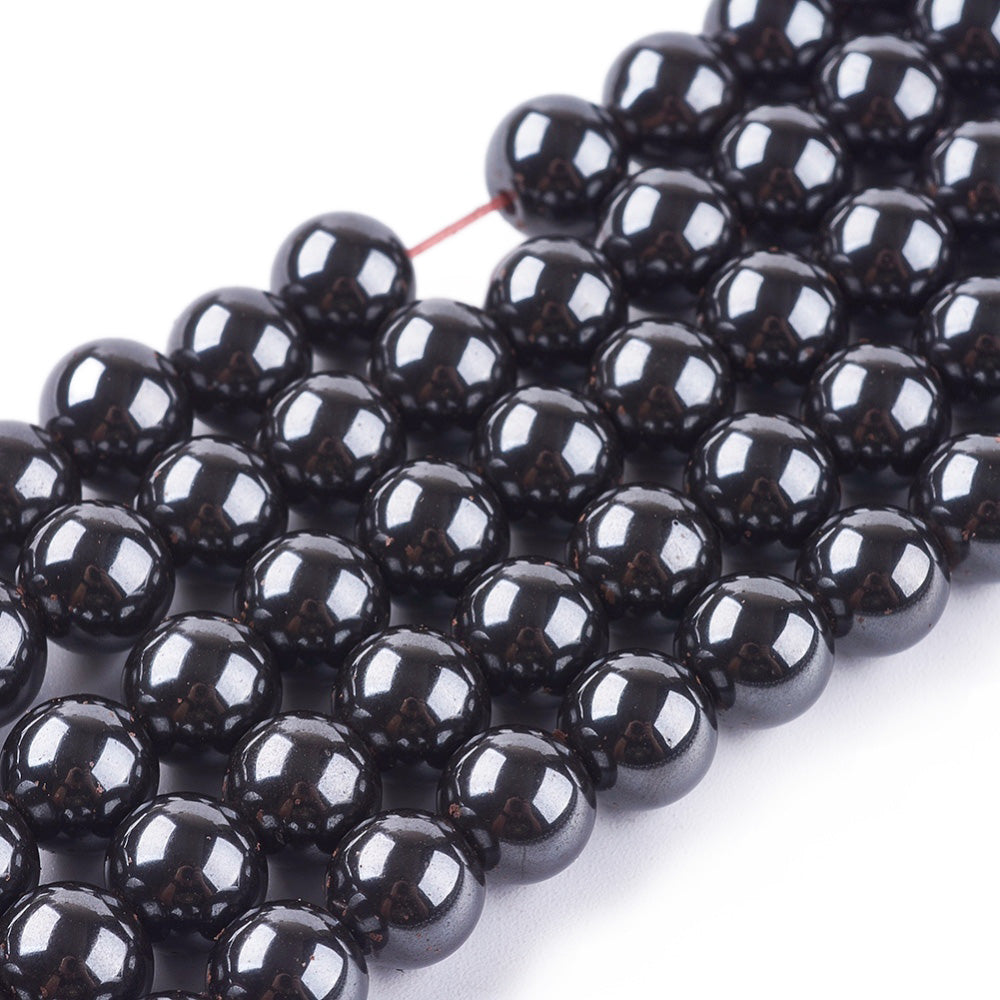 Premium Grade Magnetic Hematite Beads, Round, Metallic Gunmetal Color. Semi-Precious Stone Beads for Jewelry Making. Affordable Beads for Jewelry Making.  Size: 6mm Diameter, Hole: 1mm, approx. 64pcs/strand, 15 Inches Long.  Material: Grade A, Magnetic Hematite Bead Strands. Metallic Black/Grey Colored Stone Beads. Polished, Shinny Metallic Lustrous Finish.