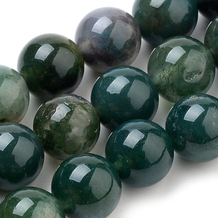 Premium Quality Natural Moss Agate Beads, Round, Dark Green Color. Semi-Precious Gemstone Beads for Jewelry Making. Great for Stretch Bracelets and Necklaces.  Size: 8mm Diameter, Hole: 1mm; approx. 47pcs/strand, 15" Inches Long.  Material: Natural Moss Agate, Dark Emerald Green Color. Polished, Shinny Finish. bead and more