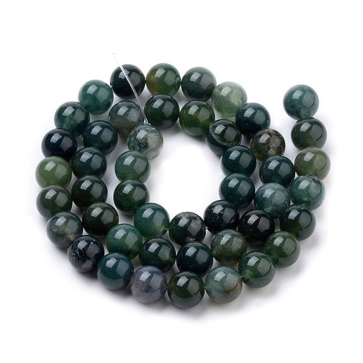 Natural Moss Agate Beads, Round, Dark Green Color. Semi-Precious Gemstone Beads for Jewelry Making.&nbsp;

Sizes:

6mm Diameter, Hole: 1mm; approx. 62pcs/strand, 15" Inches Long.

8mm Diameter, Hole: 1mm; approx. 47pcs/strand, 15" Inches Long.

10mm Diameter, Hole: 1mm; approx. 37pcs/strand, 15" Inches Long

Material: Natural Moss Agate, Dark Emerald Green Color. Polished, Shinny Finish.

Moss Agate Properties:&nbsp;Moss Agate is Known as the Stone of New Beginnings. It's Believed that the Stone Attracts Ab