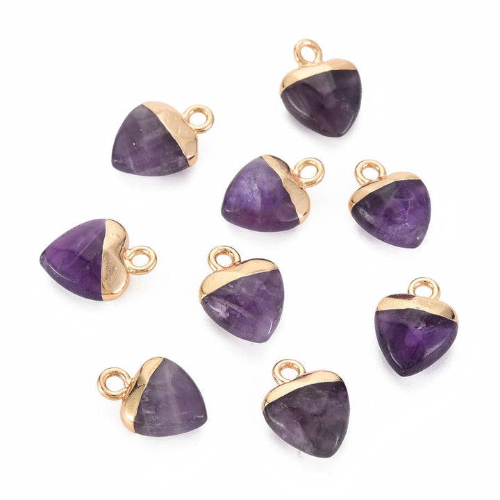 Natural Amethyst Heart Shaped Charms, Purple Color with Golden Plated Findings. Semi-precious Gemstone Pendant for DIY Jewelry Making.  Size: 13-13.5mm Length, 10-10.5mm Wide, 5mm Thick, Hole: 1.5mm, 1pcs/package.   Material: Genuine Natural Amethyst Charms, Gold Plated Iron Findings. Heart Shaped Stone Pendants. Polished Finish. 