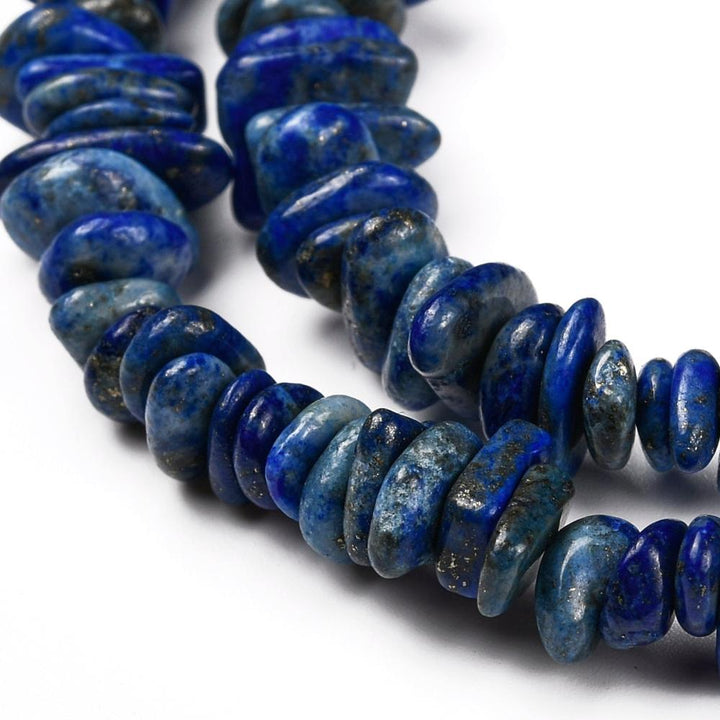 Natural Lapis Lazuli Chip Bead Strands, Round, Dyed, Chips, Intense Deep Blue Color. Semi-precious Lapis Lazuli Gemstone Chip Beads for DIY Jewelry Making.   Size: 5~8x5~8mm chips, Hole: 1mm; approx. 31.5 inches.