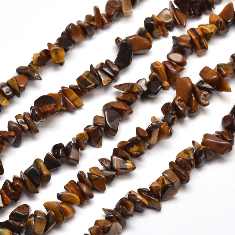 Natural Tiger Eye Chip Bead Strands. Semi-precious Gemstone Tiger Eye Chip Beads for DIY Jewelry Making.  High Quality Beads for Making Mala Bracelets. Size: about 5~8mm wide, 5~8mm long, hole: 1mm; approx. 31.5" inches.