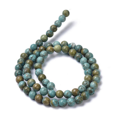 Natural Howlite Beads, Round, Turquoise Green Color. Semi-Precious Gemstone Beads for DIY Jewelry Making. Great for Mala Bracelets.  Size: 6mm Diameter, Hole: 1mm; approx. 65pcs/strand, 15" Inches Long.  Material: Genuine Howlite Green Turquoise Beads. High Quality Natural Stone Beads. Green Turquoise Color. Shinny, Polished Finish. 