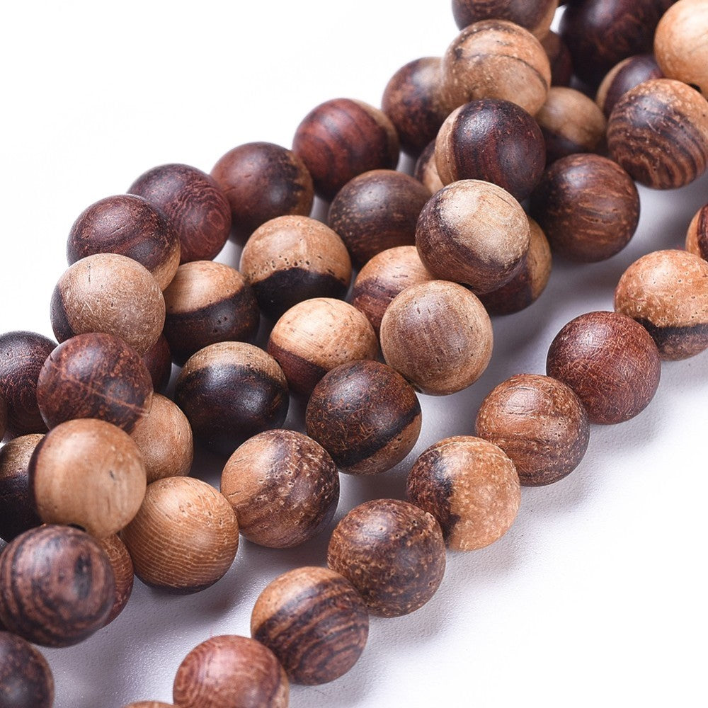 Natural Wood Beads Strands, Round, Saddle Brown Wooden Bead Strands for DIY Jewelry Making. Premium Quality Wood Beads. Great for Bracelets & Necklaces.  Size: 6mm in Diameter, Hole: 1mm; approx. 64pcs/strand, 15.5'' inches long. www.beadlot.com