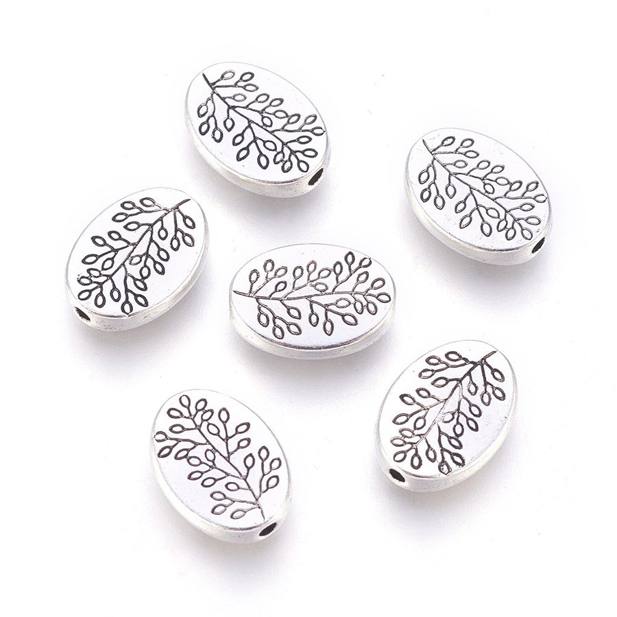 Tibetan Oval Spacer Beads, Antique Silver Color. Oval Spacers for DIY Jewelry Making Projects. High Quality, Classy, Non-Tarnish Spacers for Beading Projects. Antique Silver Tibetan Style Alloy Spacer Beads. Oval Shape with Leaf Design. Shinny Finish. 100% Lead and Nickel Free Spacers.