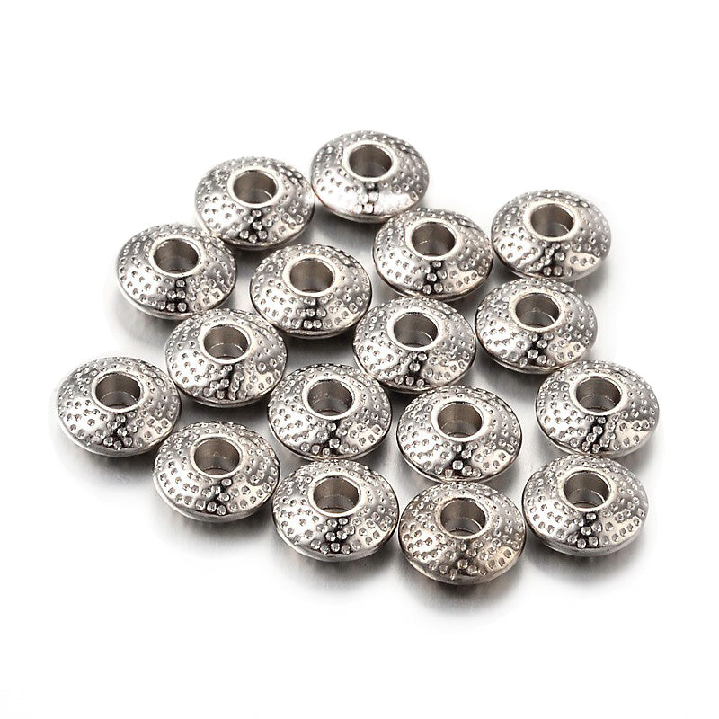 Tibetan Flat Round Spacer Beads, Platinum Silver Color. Silver Spacers for DIY Jewelry Making Projects. Disc Space Beads with Dot Design.   Size: 8mm Wide, 3mm Thick, Hole: 2.5mm, approx. 25pcs/bag.   Material:  Tibetan Style, Shinny Finish. Platinum Silver Color. Cadmium, Lead and Nickel Free Spacers.