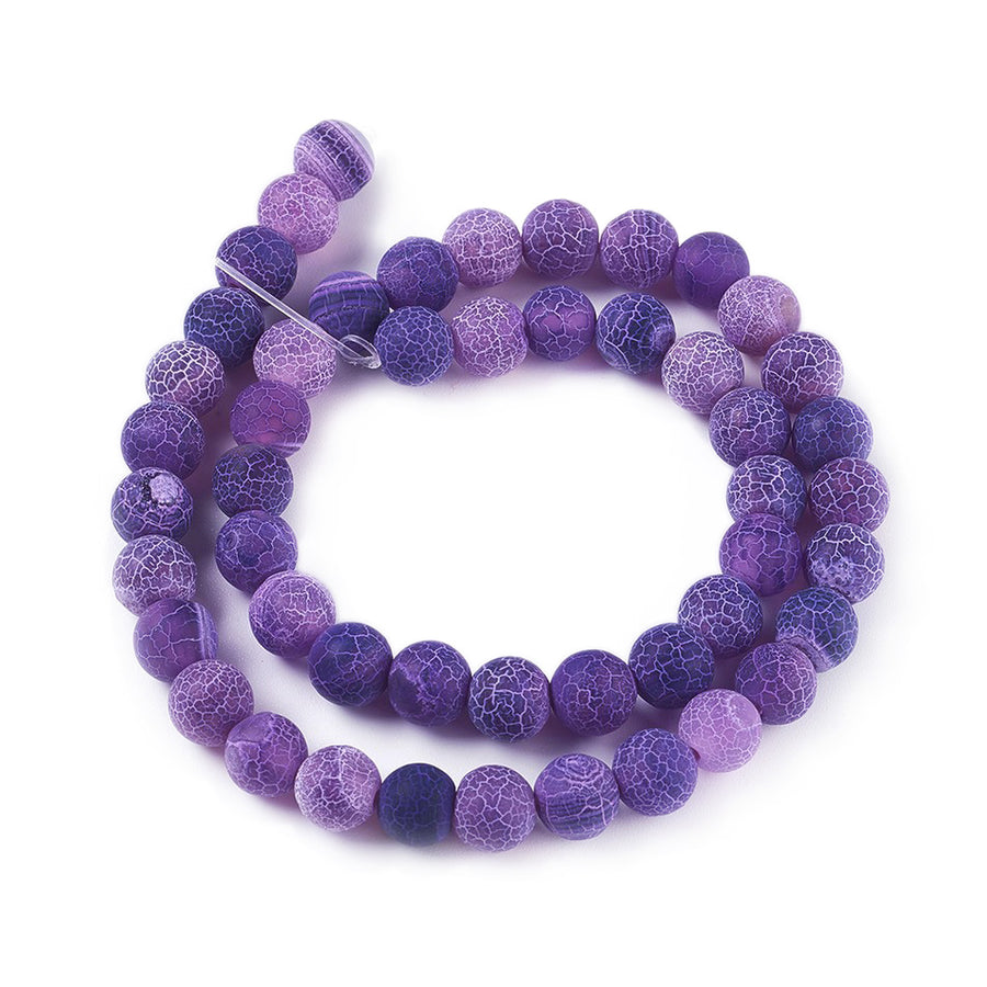 Crackle Agate Beads, Dyed, Round, Purple Color. Matte Semi-Precious Gemstone Beads for Jewelry Making. Great for Stretch Bracelets and Necklaces.  Size: 6mm Diameter, Hole: 1mm; approx. 61pcs/strand, 14.5" Inches Long.  Material: Natural & Dyed Crackle Agate, Frosted Purple Color with White Crackle Pattern. The Crackle Appearance is Created by Heating the Stone to Extreme Temperatures. Unpolished, Matte Finish.