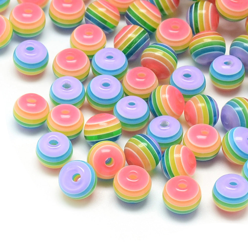 Rainbow Striped Resin Spacer Beads, Round, Multi Color. Pride Beads for DIY Jewelry Making Projects. Colorful Spacer Beads. Perfect for Stretch Bracelets.  Size: 8mm Diameter, Hole: 1.8-2mm, approx. 25pcs/package.   Material: Round Resin Spacer Beads. Multi Color, Rainbow Stripe Beads. Polished, Shinny Finish. 