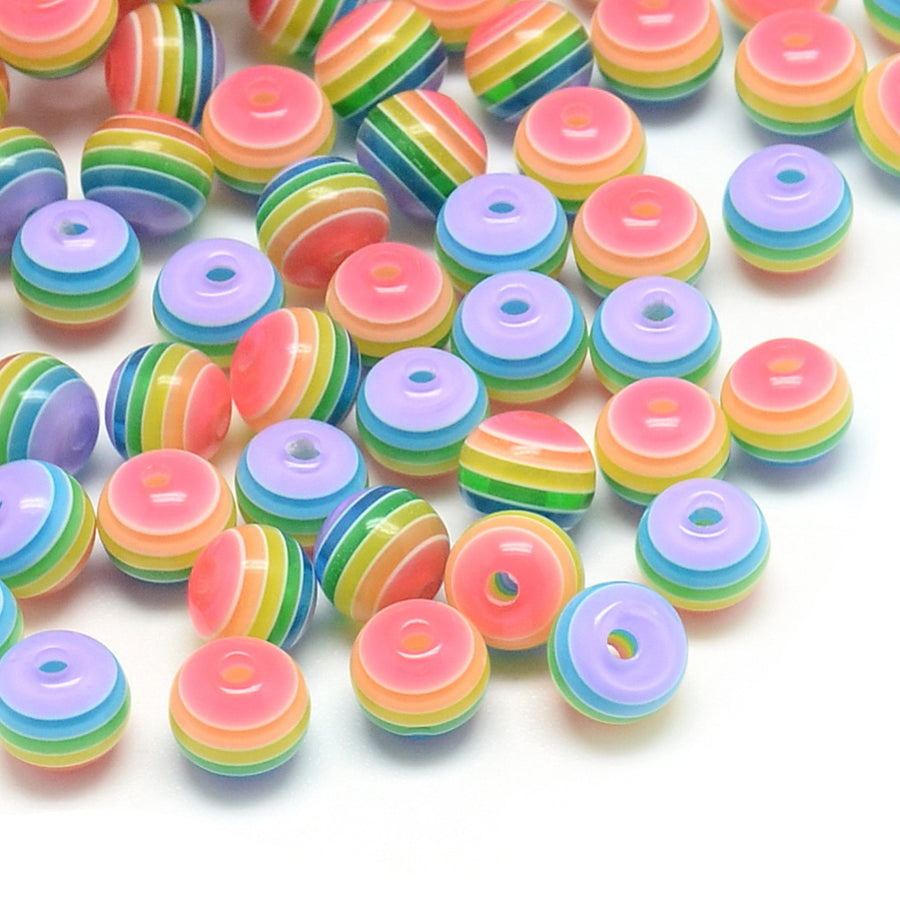Rainbow Striped Resin Spacer Beads, Round, Multi Color. Pride Beads for DIY Jewelry Making Projects. Colorful Spacer Beads. Perfect for Stretch Bracelets.  Size: 8mm Diameter, Hole: 1.8-2mm, approx. 25pcs/package.   Material: Round Resin Spacer Beads. Multi Color, Rainbow Stripe Beads. Polished, Shinny Finish. 