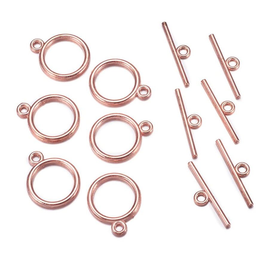 Toggle Ring Clasp for DIY Jewelry Making. Rose Gold Gold Color, Flat, Round Clasps.  Size: Ring: 15mm, 2mm Thick, Bar: 21mm, Hole: 2mm, 5 set/package.  Material: Alloy Toggle Clasps, Cadmium, Nickel and Lead Free, Rose Gold Color Clasp.   Usage: These Clasp are used to finish of necklaces or bracelets.