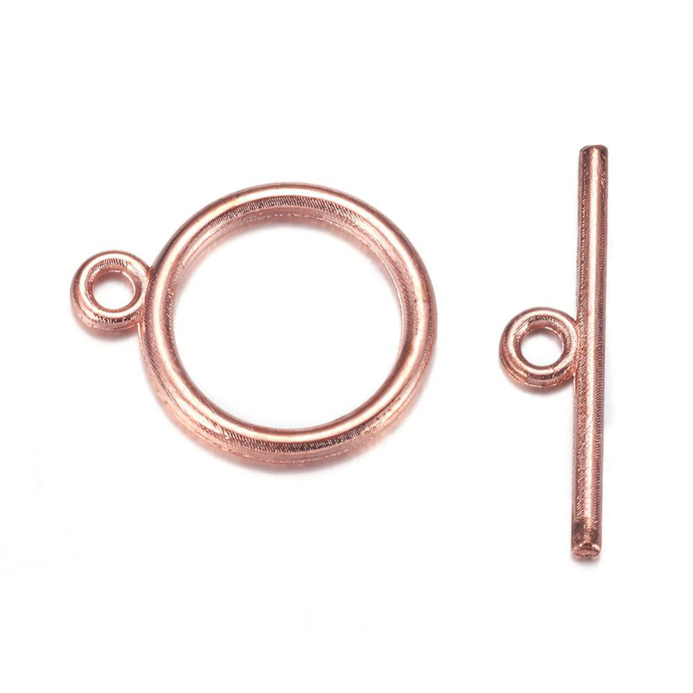 Toggle Ring Clasp for DIY Jewelry Making. Rose Gold Gold Color, Flat, Round Clasps.  Size: Ring: 15mm, 2mm Thick, Bar: 21mm, Hole: 2mm, 5 set/package.  Material: Alloy Toggle Clasps, Cadmium, Nickel and Lead Free, Rose Gold Color Clasp.   Usage: These Clasp are used to finish of necklaces or bracelets.