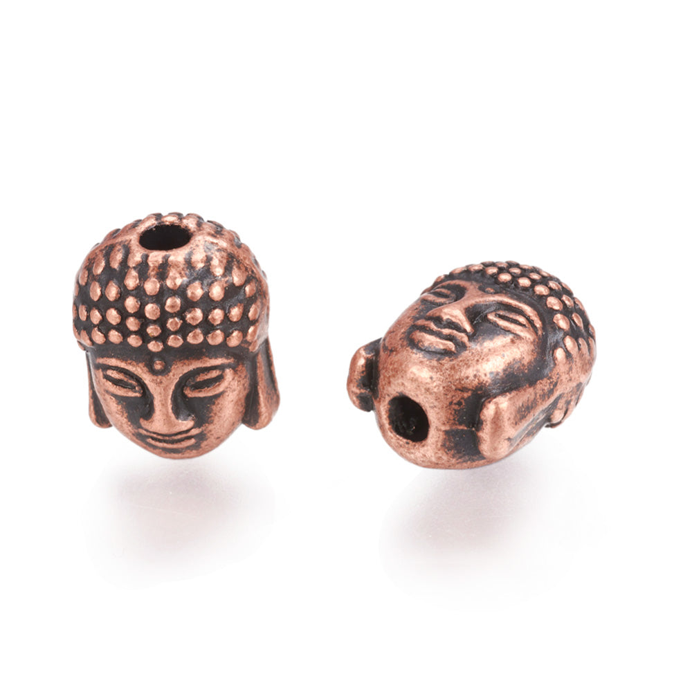 Tibetan Buddha Spacer Beads, Antique Copper Red Color. Buddha Head Spacers for DIY Jewelry Making Projects. High Quality, Non-Tarnish Focal Beads for Beading Projects. Antique Red Copper Tibetan Style Alloy Buddha Head Spacer Beads. Shinny Finish. 100% Lead and Nickel Free Spacers. www.beadlot.com