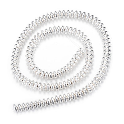 Electroplated Non-Magnetic Synthetic Hematite Beads, Silver Color. Semi-Precious Stone Spacer Beads for Jewelry Making.   Size: 4mm Wide, 2mm Thick, Hole: 1mm, approx. 175pcs/strand, 15.5" Inches Long.  Material: Non-Magnetic Synthetic Hematite Beads. Silver Color Plated. Rondelle Shape. Polished, Shinny Metallic Lustrous Finish.